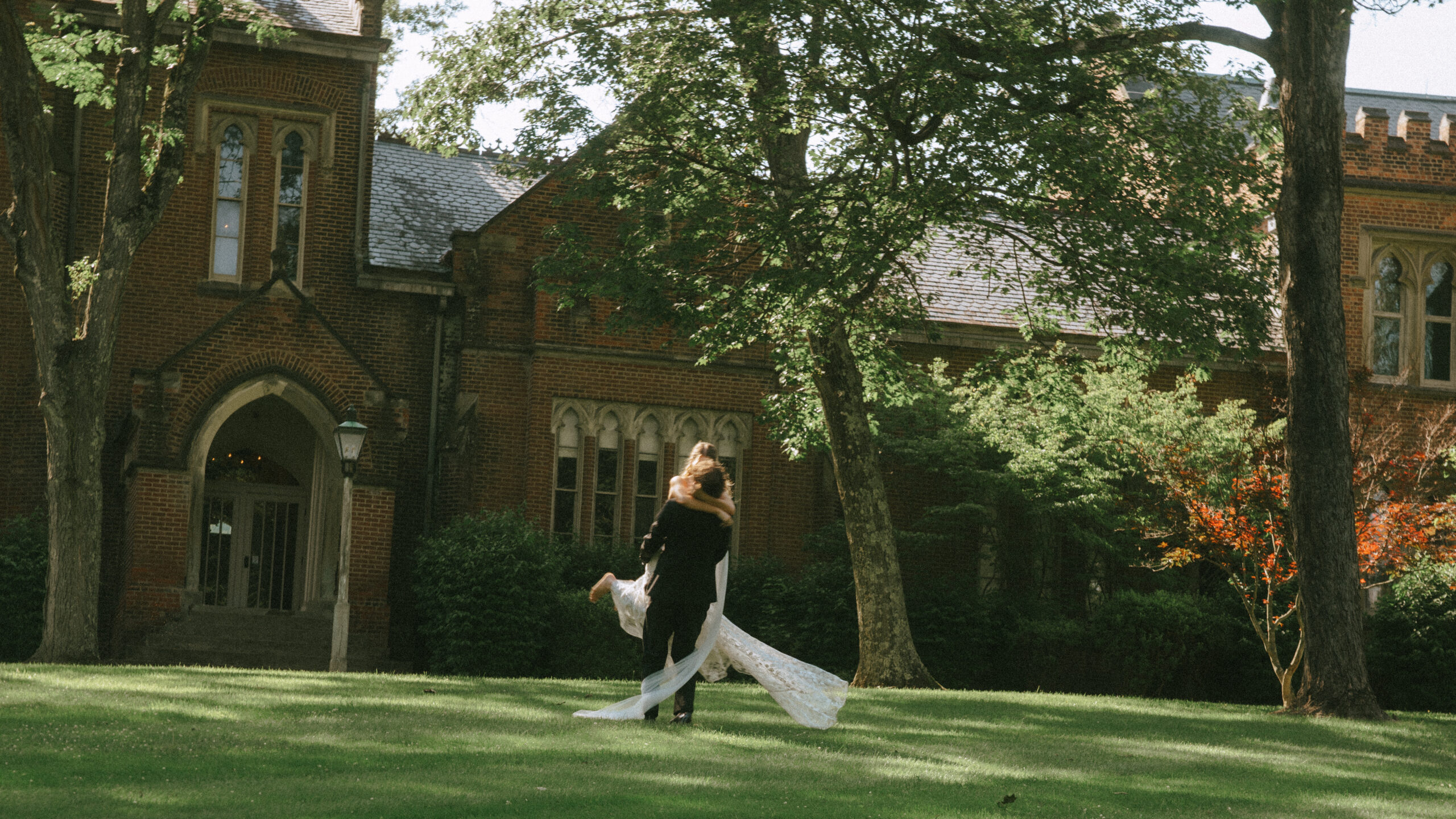 happy newly wed couple in front of church chapel