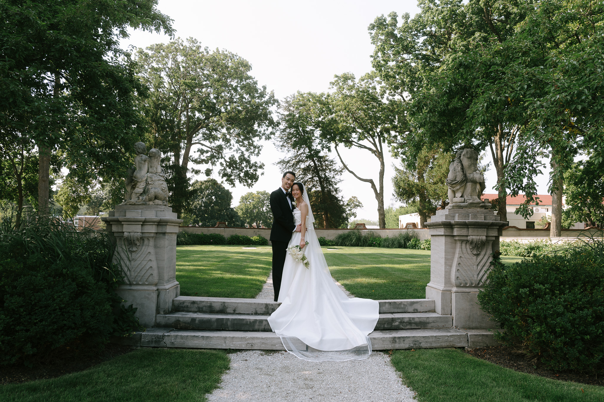 bride and groom posed outdoors