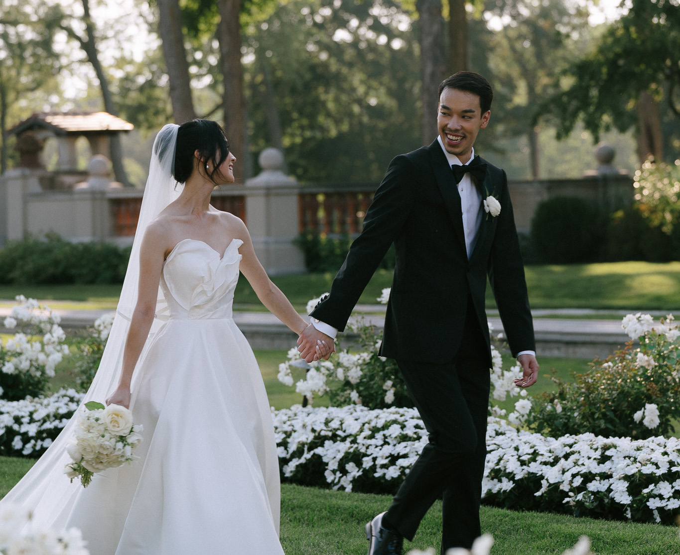 happy couple, newly weds holding hands after destination wedding ceremony