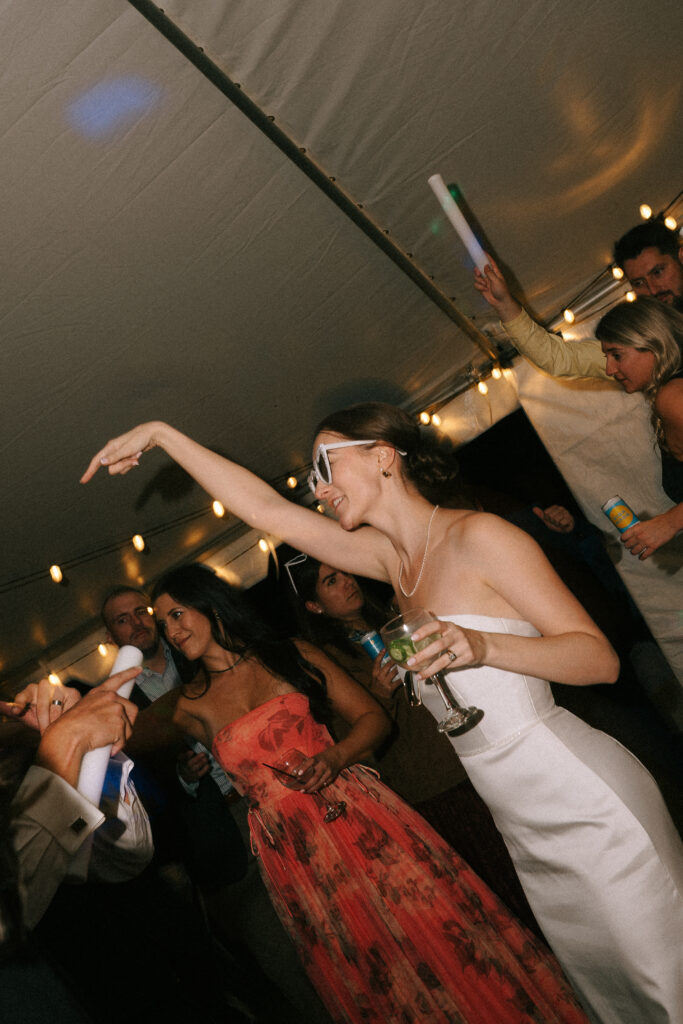 candid photo of bride and guests at wedding reception